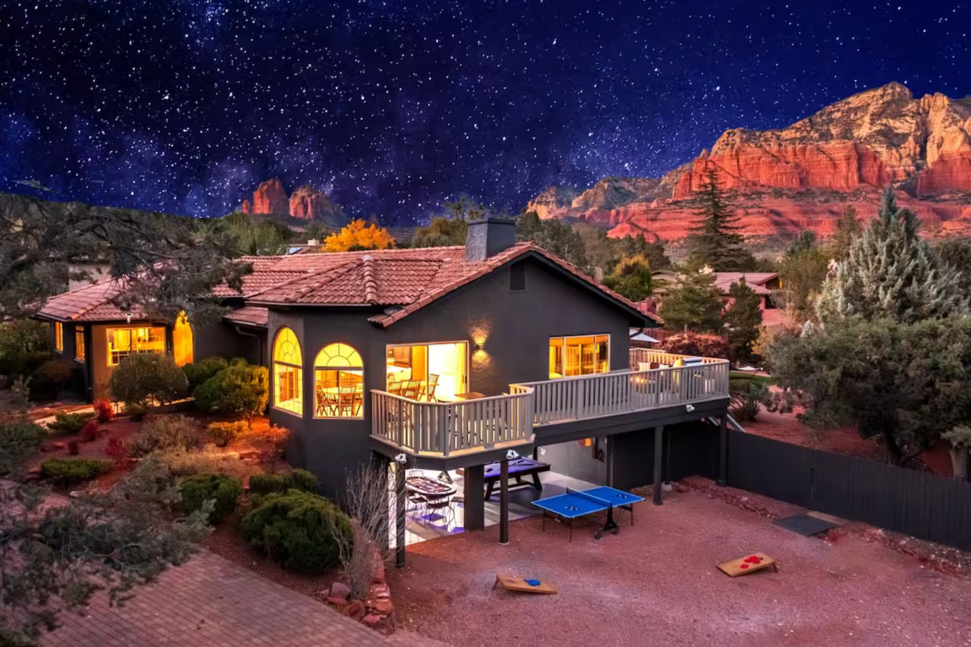 exterior view of a luxury vacation rental property with red rock views, ping pong table, and cornhole
