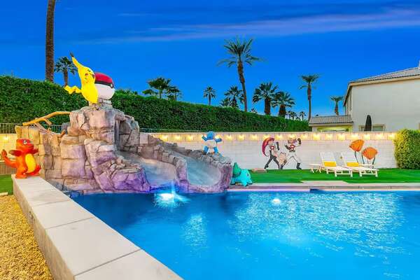 double slide into a luxury pool at a pokemon-themed vacation rental