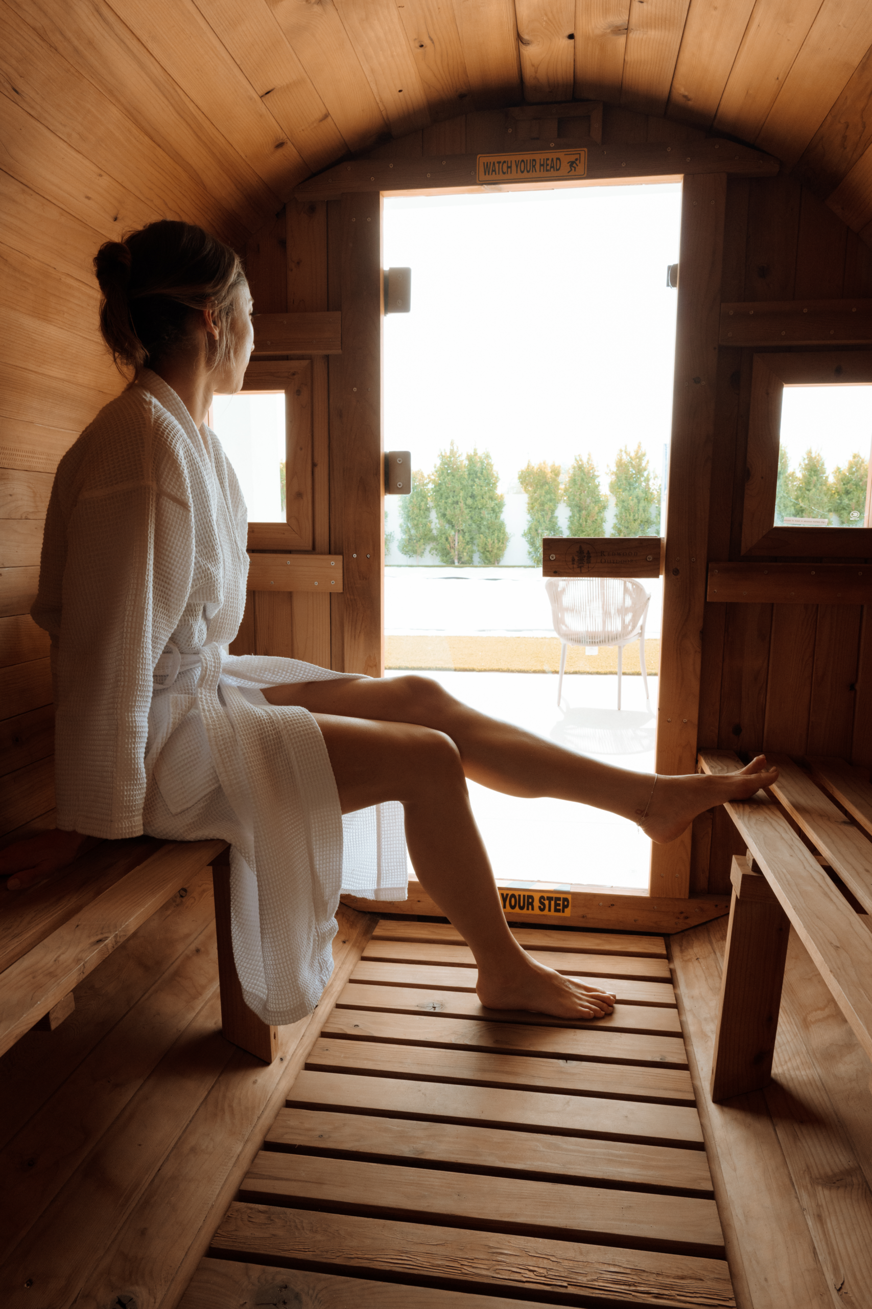 Woman relaxing in sauna