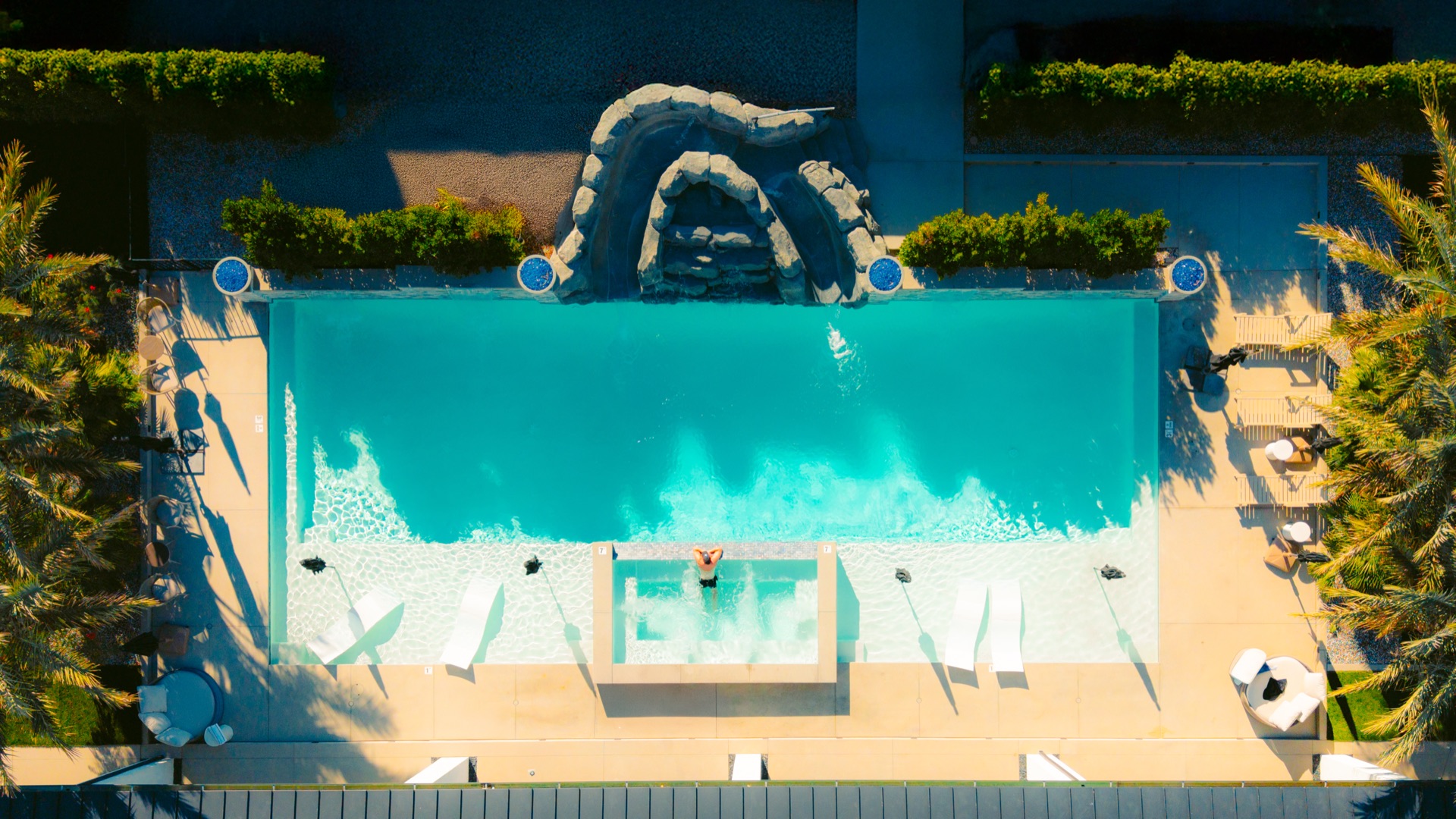 Aerial view of the Premiere Estate pool and waterslide grotto in Indio, California